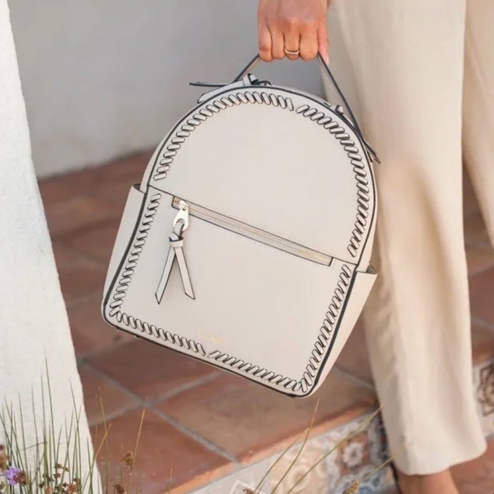 Stylish Cream Backpack with Black Accents